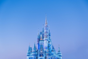 Walt Disney World's Magic Kingdom Cinderella Castle decorated with Christmas light for the holiday season.